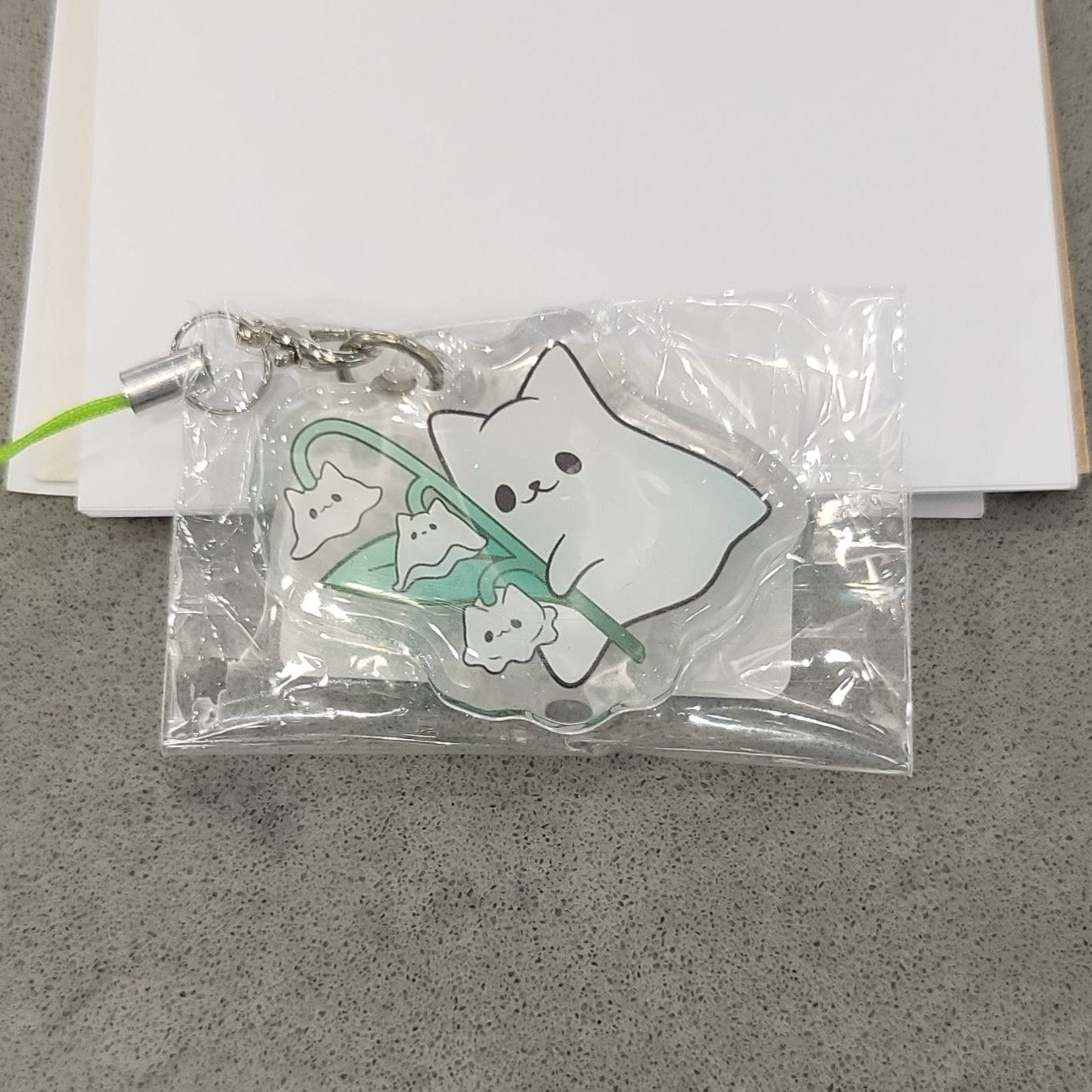 ghost cat with lily of the cats charm