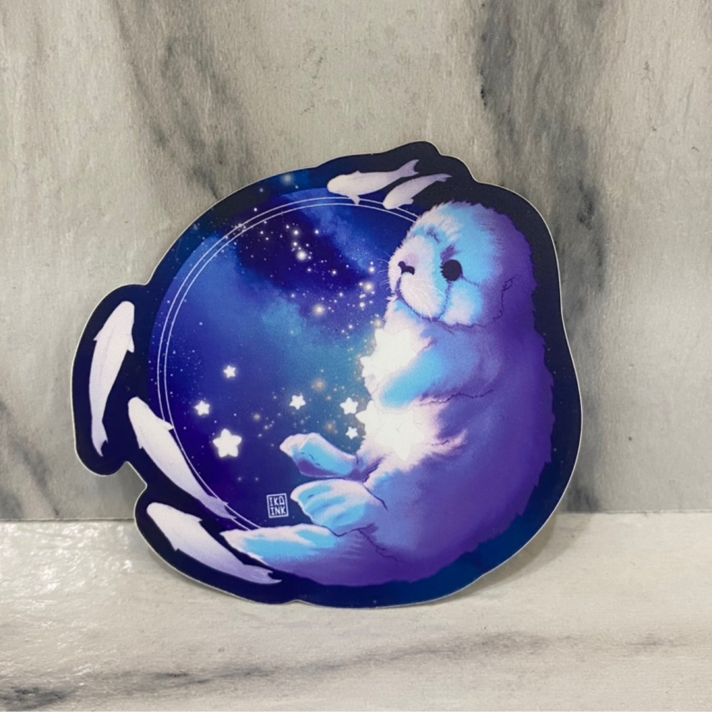 Sea Otter Galactic Matte Holo Sticker (blue w/ fish)